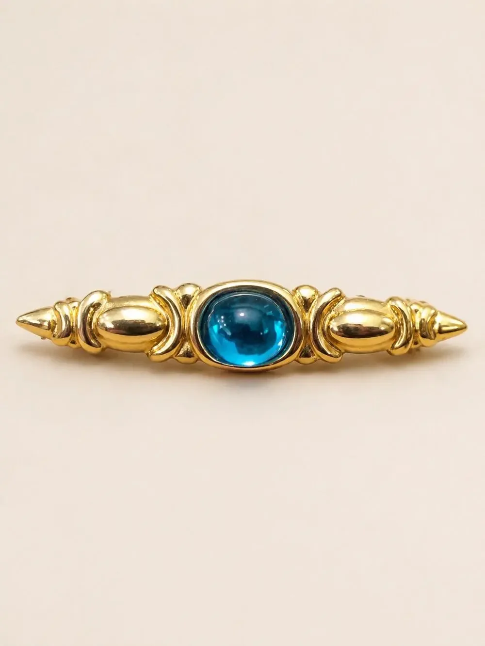 Vintage Monet Gold-tone bar brooch/pin blue domed cabochon center